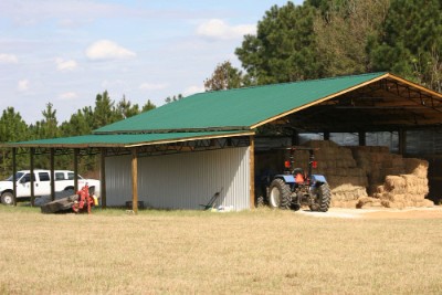 Store house with forest green rib roofing and polar white rib walls