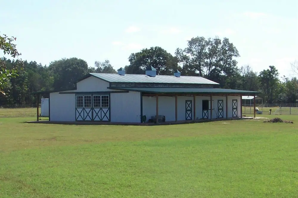Animal stable with metal roofing and walls